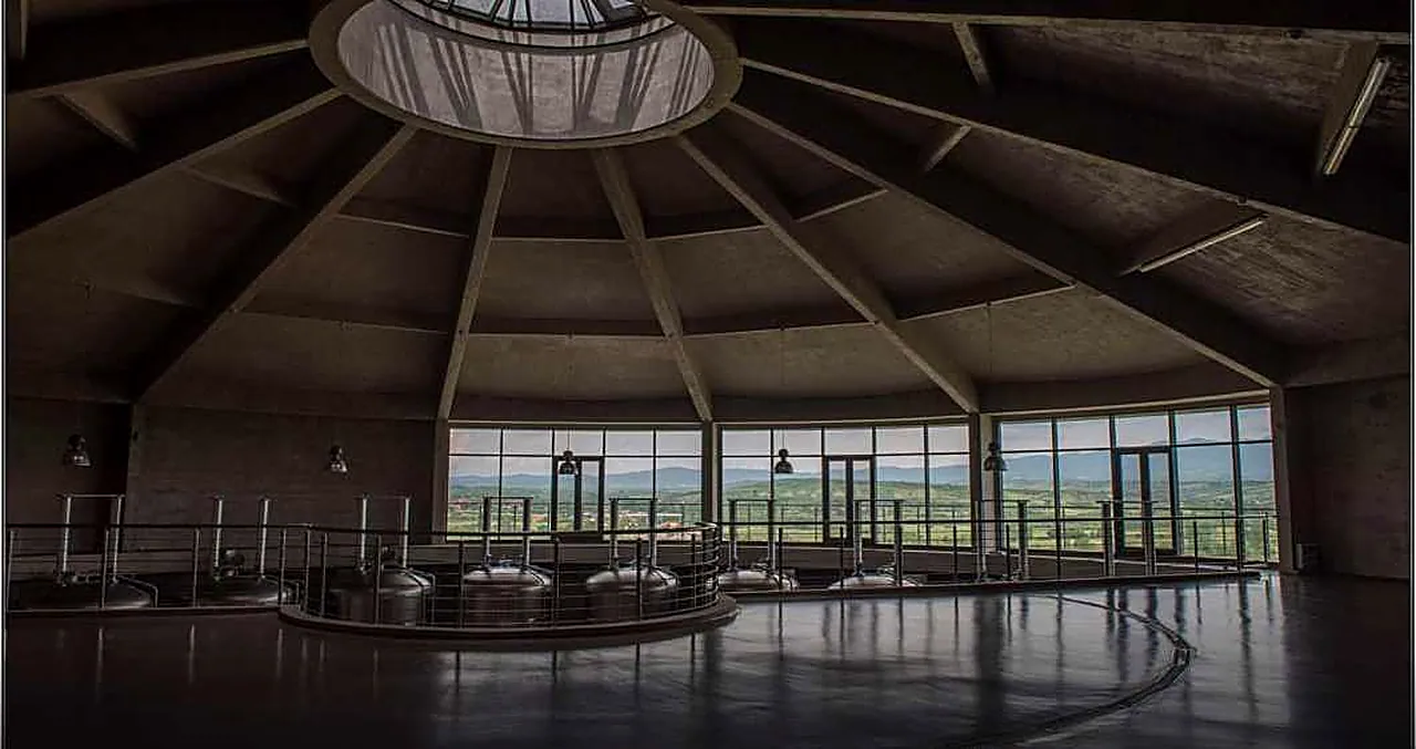 The round fermentation hall, ringed with glass and lit from a central oculus in the concrete roof.